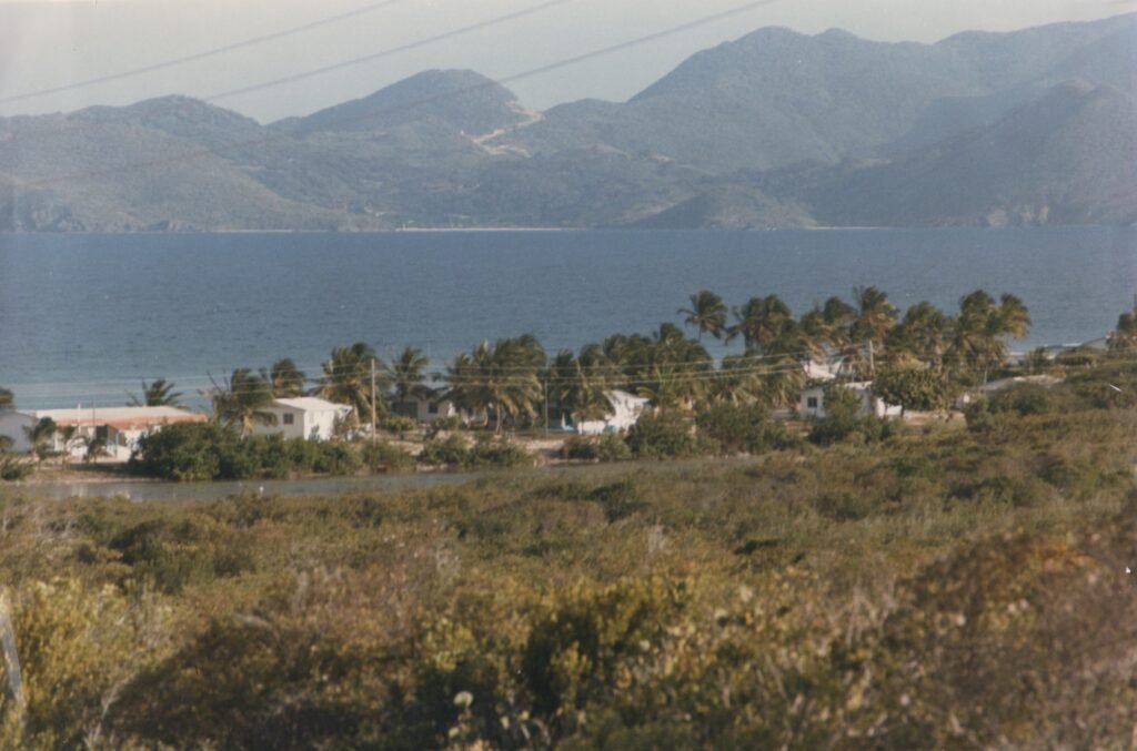 Corito Beach Cottages, Anguilla, 1984. St. Martin in the distance. Photo by Gary Rodrigues. Copyright 1984-2026.